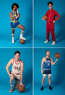 Four people in various basketball-themed outfits posing with basketballs against a solid blue backdrop.