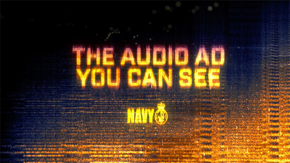 Glowing orange text reads 'THE AUDIO AD YOU CAN SEE' over a dark, textured background with the word 'NAVY'.