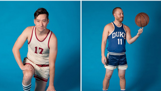 Two men in vintage basketball uniforms posing against a solid blue backdrop.