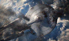 A large, metallic saucer-shaped spacecraft flying through a cloudy sky.