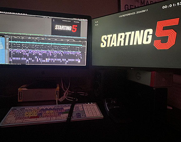 Two computer monitors in a dark room showing video editing software and a 'STARTING 5' title card.