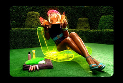 A woman in a pink hat and dark outfit reclines in a glowing yellow chair on a green lawn.