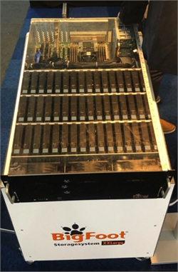 A large white BigFoot Storagesystem XXLarge unit with multiple black server modules inside a clear casing.