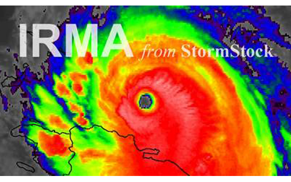 A colorful satellite weather map showing a large hurricane with a defined eye over a coastal region.