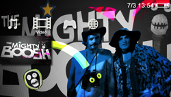 Two men in eccentric costumes pose against a graphic background with music and video icons.
