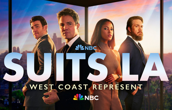 Four actors in professional attire pose against a sunset city skyline with the text Suits LA.