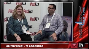 A woman and a man sit side-by-side in front of a Post TV branded backdrop.