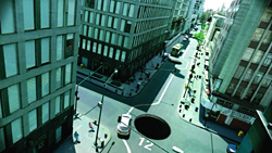 High-angle view of a city street intersection featuring a large black hole in the middle of the road.