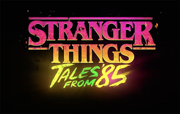 Stylized colorful text reading Stranger Things Tales from 85 against a dark background.