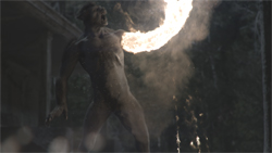 A muscular, dark-skinned humanoid figure with a trail of fire emanating from its chest.