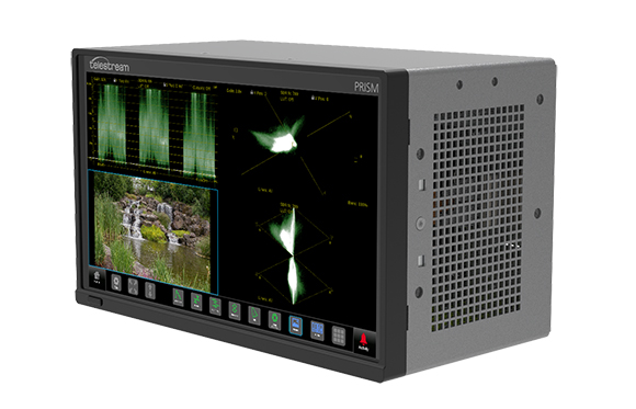 A Telestream PRISM video analysis device showing signal waveforms and a landscape video on its screen.