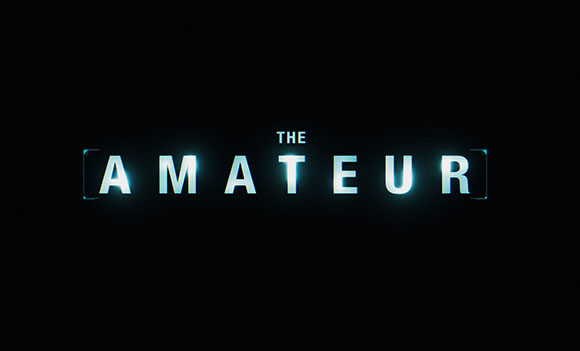 The words THE AMATEUR in glowing white capital letters against a black background.