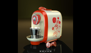 A vintage-style red and cream espresso machine with floral patterns and a small glass cup.