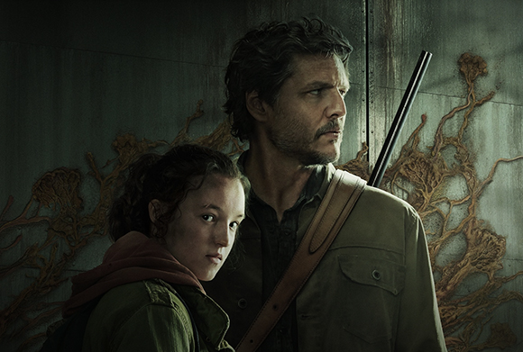 A man with dark hair and a young girl with curly hair look off-camera against a dark, textured wall.