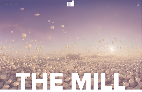 Thousands of white balloons covering a landscape under a soft purple sky with large white text reading THE MILL.