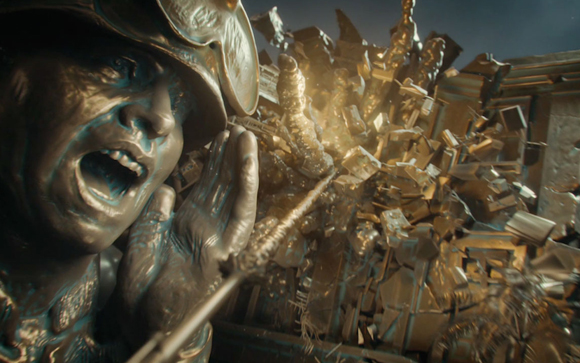 Close-up of a bronze sculpture of a soldier shouting with hands near his mouth.
