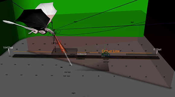A 3D digital model showing a green background, a long horizontal bar, and various technical lines and labels.