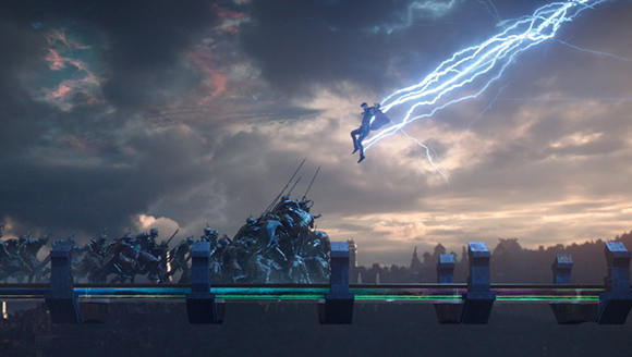 A person flying through a bright bolt of lightning above a line of large mechanical creatures.