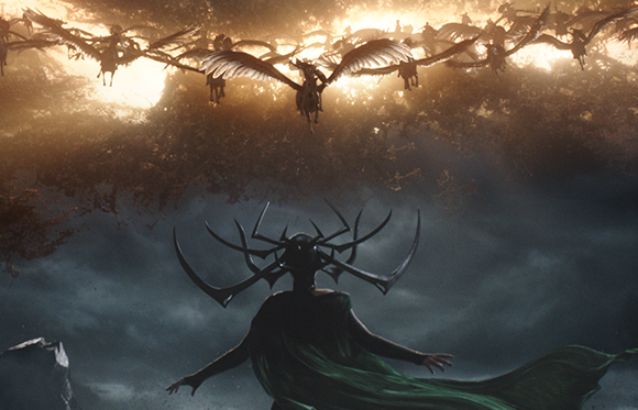 A dark silhouette with large, curved horns looks up at winged creatures flying through a bright, hazy sky.