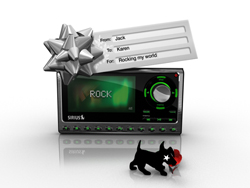 A Sirius satellite radio device with a silver gift bow and a note reading 'From: Jack To: Karen For: Rocking my world'.