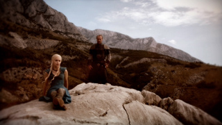 A blonde woman in a blue dress sits on a large rock as a man in armor stands behind her in a mountain valley.