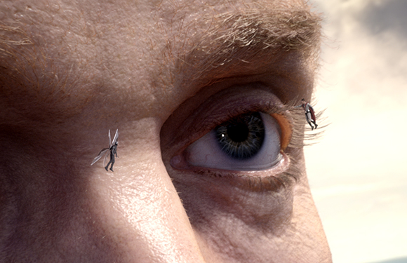 Tiny human figures crawling on the skin near a person's eye and eyebrow.