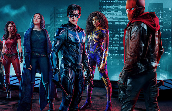 Five superheroes in colorful tactical suits stand together against a glowing blue city backdrop.