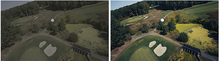 Aerial view of green golf course fairways, sand traps, and surrounding trees.