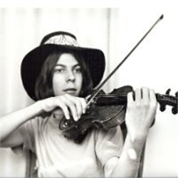 A person wearing a wide-brimmed hat while playing a violin with a bow.