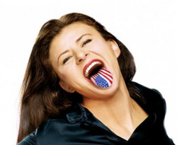 A woman smiles widely with her mouth open, revealing a tongue patterned with the American flag.