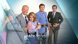 Four people in business attire posing against a light blue and white gradient background.