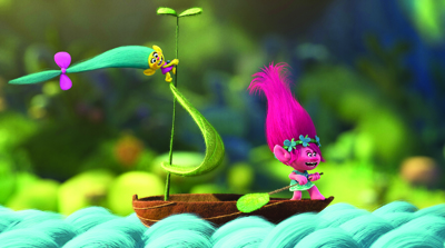 A pink troll with upright hair stands on a small wooden boat with a green leaf sail in a lush forest.