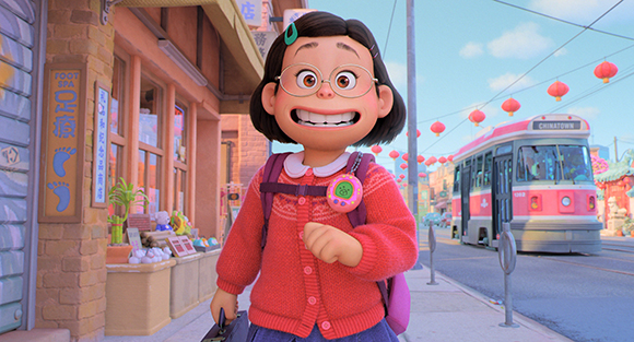 Animated girl with dark hair and glasses wearing a red sweater walks down a city street.