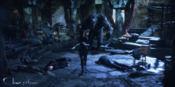 A large, dark creature stands over a person in a dimly lit, stone-walled room filled with debris.