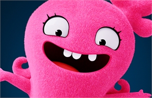 A bright pink, fuzzy cartoon monster with large white eyes and a wide, toothy grin against a dark blue background.