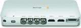 Rear view of a white electronic device showing multiple connection ports including USB, HDMI, and audio jacks.