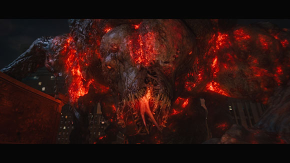 A giant, monstrous creature made of dark rock and glowing red lava looming over a dark cityscape.