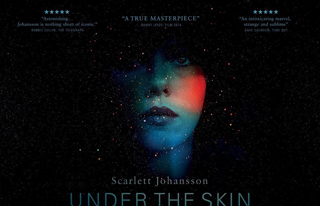 A woman's face emerges from a dark, starry background with a red light glow on her cheek.