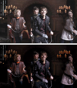 Four children in fantasy costumes holding props in a dark, stone room with lit candles.