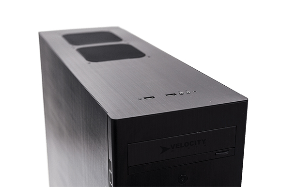 A black rectangular computer tower with top ports and a front-facing media bay.