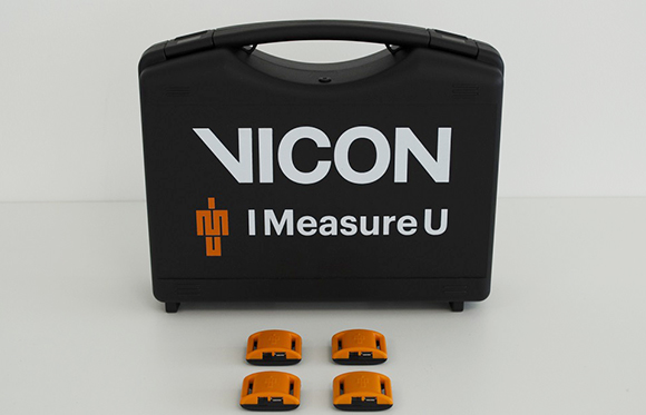 A black hard-shell carrying case with white and orange Vicon I Measure U branding and four small orange sensors.