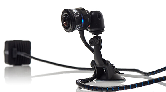 A small black cylindrical security camera mounted on a flexible arm with a suction cup base.