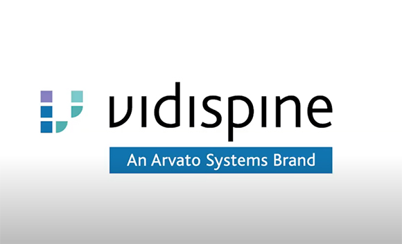 Vidispine logo with a blue and purple geometric icon and the text 'An Arvato Systems Brand'.
