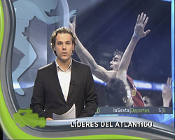 A man in a dark suit and white shirt stands before a sports broadcast background with basketball imagery.