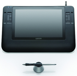A black Wacom graphics tablet with a stylus resting in a stand below it.