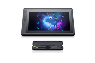 A black digital drawing tablet displaying a blue cartoon creature above a black stylus case.