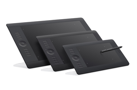 Three black digital graphics tablets of different sizes arranged diagonally on a white background.