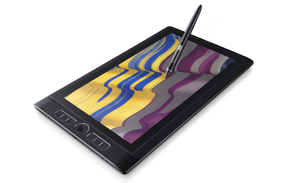 A black digital graphics tablet displaying colorful wavy patterns with a black stylus pen touching the screen.