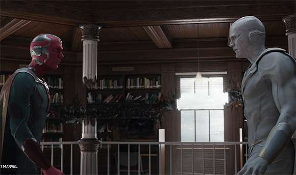 The red Vision and the silver Ultron stand face-to-face in a wood-paneled library.