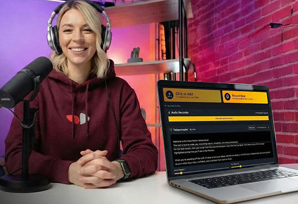 Smiling woman with blonde hair wearing headphones, sitting by a microphone and a laptop displaying audio software.